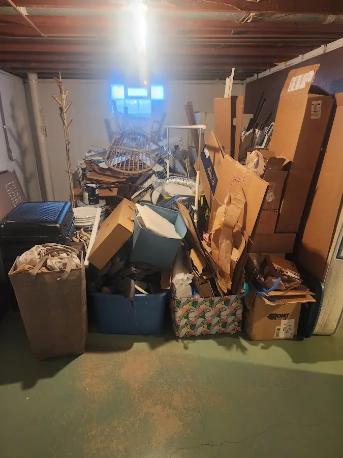 Roll-off dumpster container at job site for 2 Yard Dumpster Rental in Hohenwald